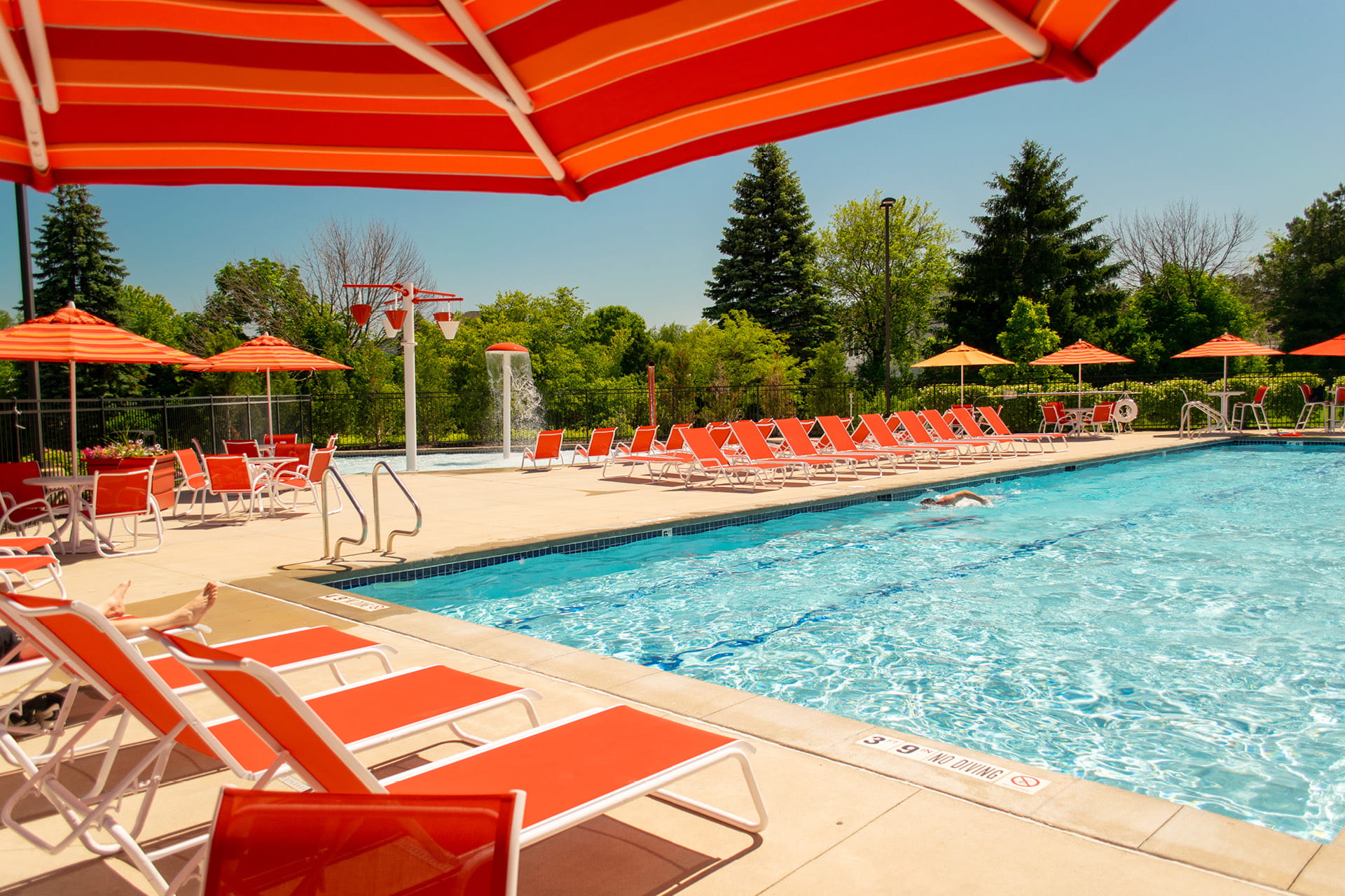 Outdoor pool with lounge chairs