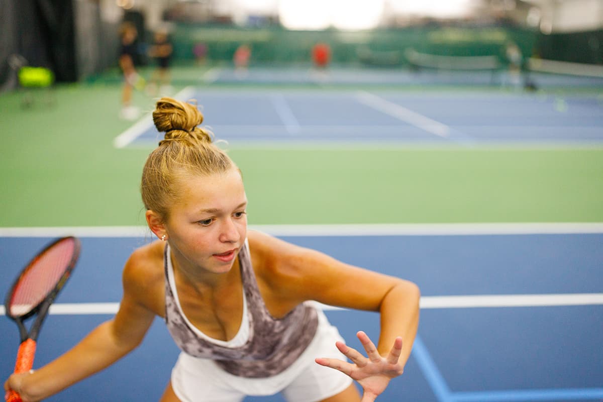 Young girl plays tennis