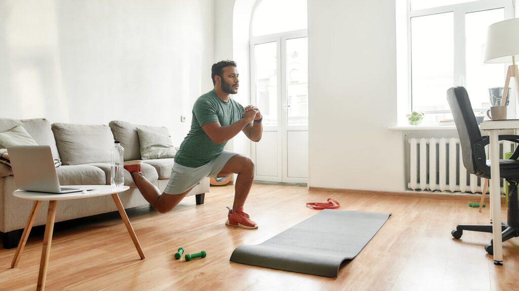 Man doing lunges at home workout