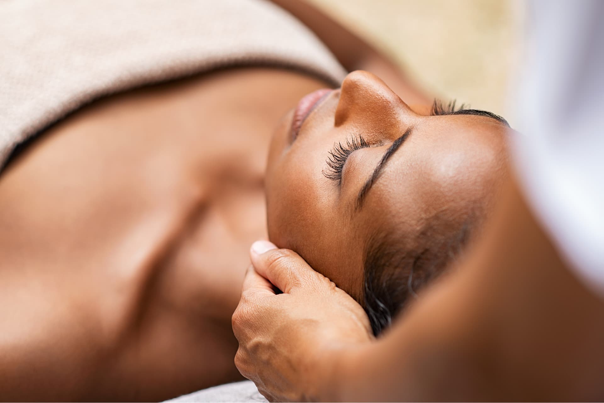 Woman receiving massage from therapist