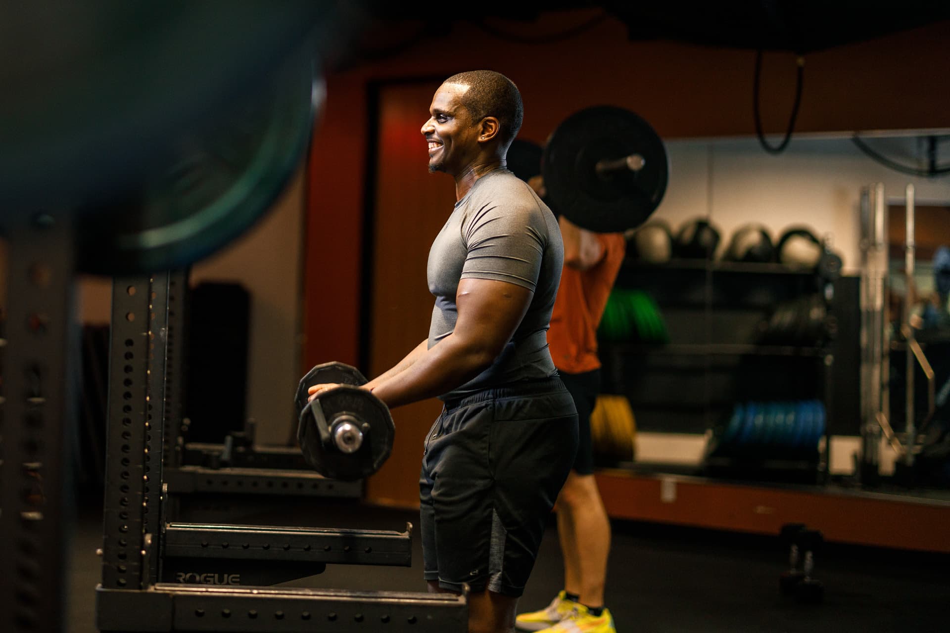 Man lifts weights in gym