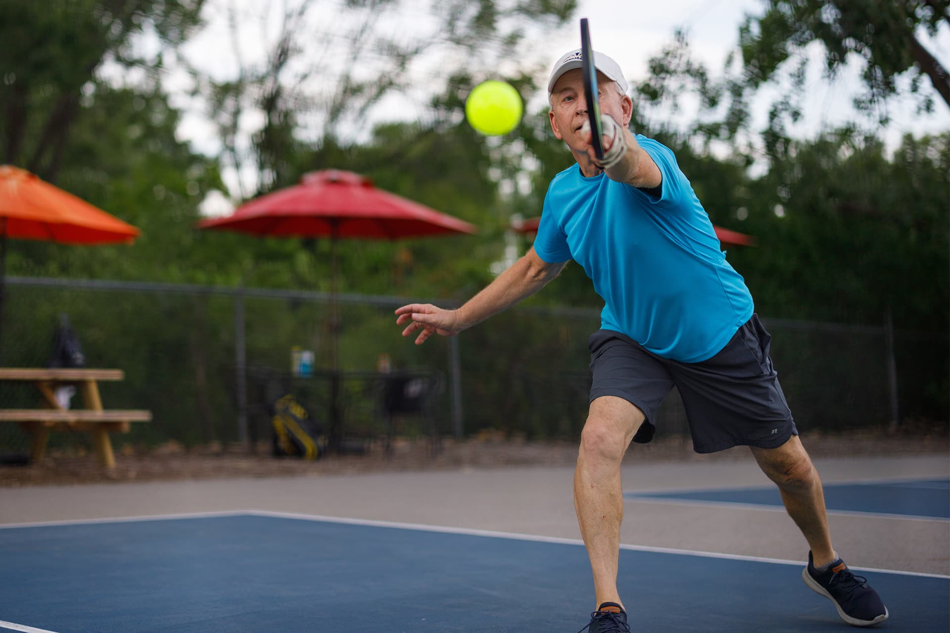 Man plays outdoor pickleball