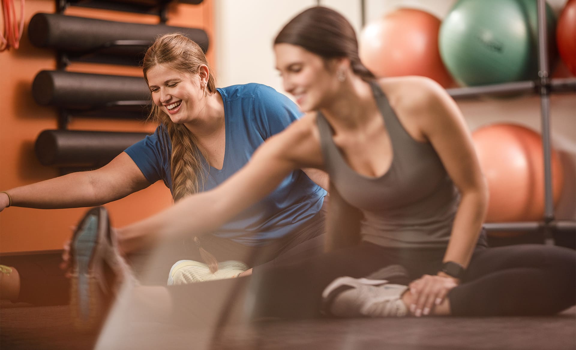 Women stretch in fitness center